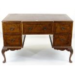 GEORGE II-STYLE BURR WALNUT & MAHOGANY CROSSBANDED KNEEHOLE DESK, red leather inset top above