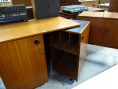 MID-CENTURY TEAK METAMORPHIC DESK with swing out side and ebonised top, together with small mid-