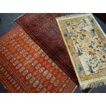 THREE ORIENTAL RUGS, comprising a Turkomen rug 184 x 126cms, Caucasian narrow rug 225 x 103cms,