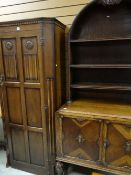 TWO REPRODUCTION OAK CABINETS comprising single drawer wardrobe and arch top dresser, both in the