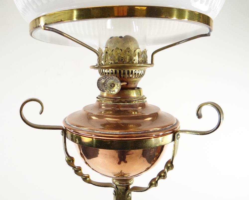 ARTS & CRAFTS BRASS AND COPPER STANDARD OIL LAMP, with foliate decorated tripod base and column, - Image 5 of 20