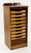 VINTAGE OAK TAMBOUR FRONTED OFFICE CABINET opening to reveal bank of nine document drawers, 41 x