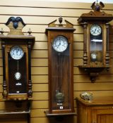 THREE GERMAN VIENNA-STYLE WALL CLOCKS, all with roman two part white enamel dials, one with parcel