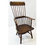 EARLY 19TH CENTURY PRIMITIVE WELSH ELM & OAK ARMCHAIR, with comb back, bent back rail, saddle seat