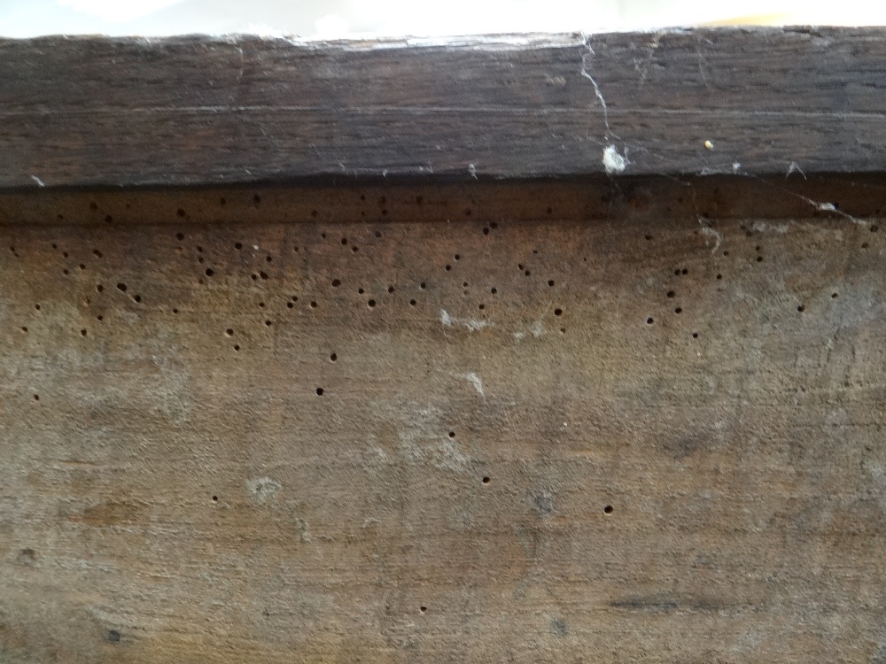 SMALL 17TH CENTURY JOINED OAK COFFER, boarded top with zigzag and dot motif to the scalloped edge, - Image 8 of 16