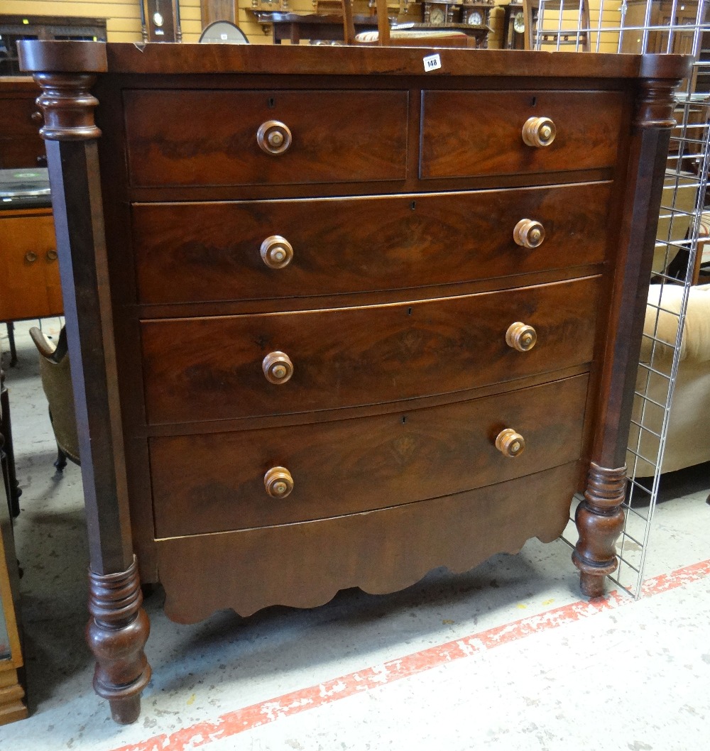 LATE VICTORIAN WALNUT BOWFRONT CHEST with outset octagonal columns and five drawers, shaped apron,