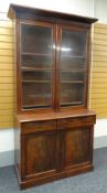 19TH CENTURY MAHOGANY BOOKCASE, angled cornice above glazed doors with gilt brass moulding and