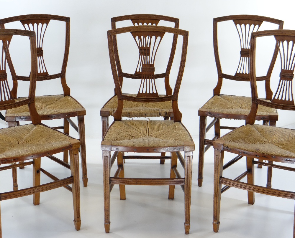 SET OF SIX STYLISH WALNUT & RUSH SEATED DINING CHAIRS with squared backs and pierced vase splats,