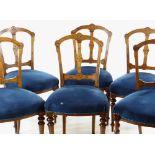 SET OF SIX LATE VICTORIAN WALNUT DINING CHAIRS, with engraved open backs, shaped stuffover seats