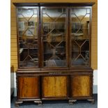 FINE WARING & GILLOW MAHOGANY BREAKFRONT BOOKCASE, foliate carved cavetto cornice above astragal