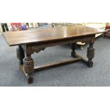 ELIZABETHAN-STYLE OAK REFECTORY TABLE, boarded top above channel carved frieze with scrolled