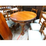 VICTORIAN-STYLE MAHOGANY EXTENDING OVAL DINING TABLE, with one extra leaf, gadrooned edge and leaf