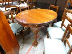 VICTORIAN-STYLE MAHOGANY EXTENDING OVAL DINING TABLE, with one extra leaf, gadrooned edge and leaf