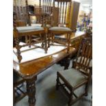 JACOBEAN-STYLE OAK DINING TABLE with leaf carved moulded edge and turned legs, together with six