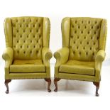 PAIR GEORGIAN-STYLE WINGBACK ARMCHAIRS, button upholstered in mustard leather (faded) (2) COLLECTING
