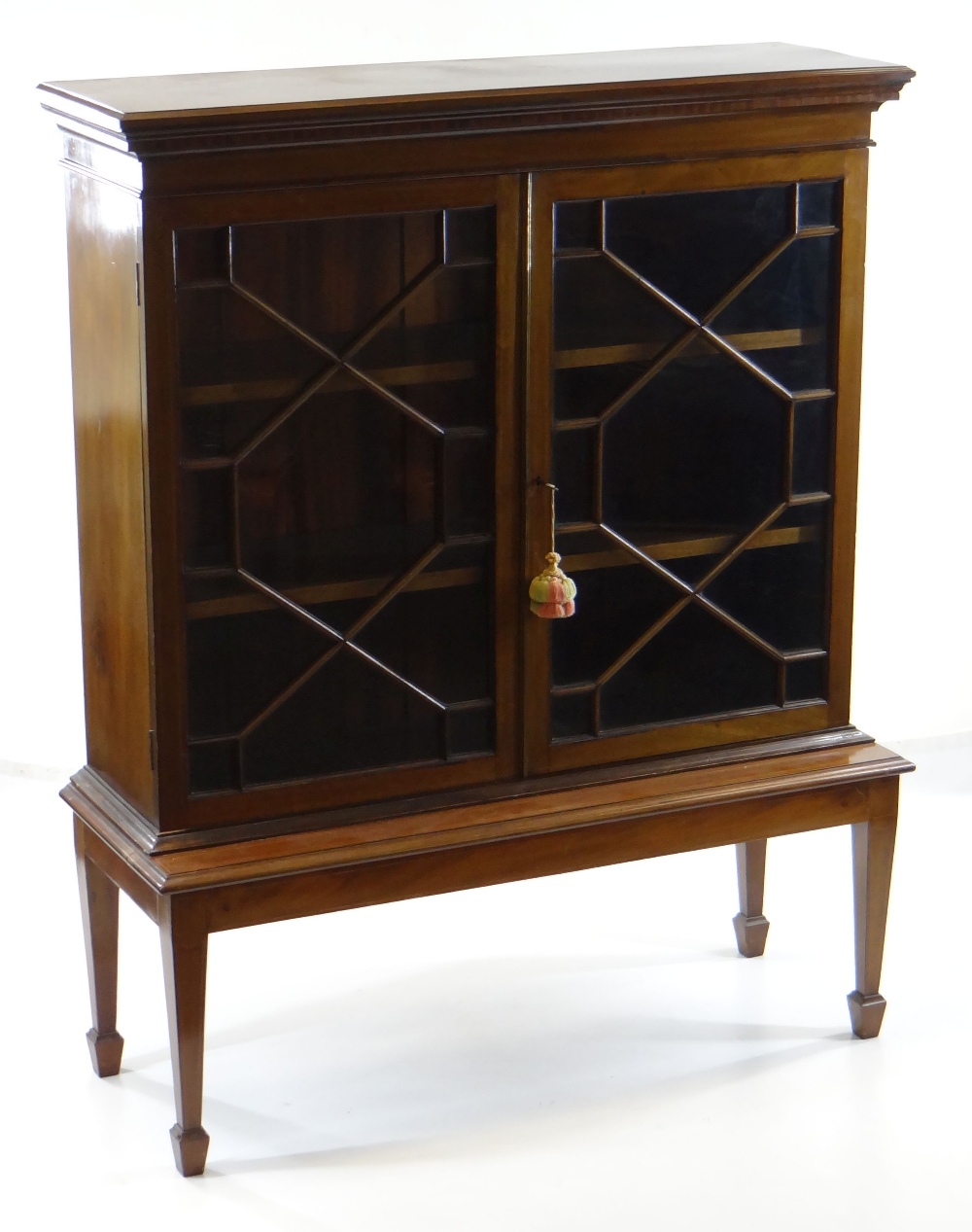 GEORGE III-STYLE MAHOGANY & BOXWOOD STRUNG BOOKCASE ON STAND, inlaid frieze above astragal glazed