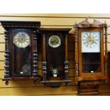 THREE 20TH CENTURY WALNUT WALL CLOCKS including an American parquetry clock with floral base,