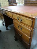 GEORGIAN-STYLE MAHOGANY PEDESTAL DESK, later leather inset top above an arrangement of nine