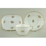 A SWANSEA PORCELAIN PART TEA SERVICE WITH BASKET WEAVE MOULDING comprising breakfast cup with