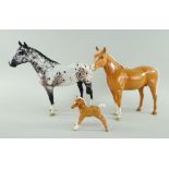 THREE BESWICK POTTERY HORSES comprising gloss Palomino Arab Bahram, model No. 1771, 19cms high,