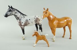 THREE BESWICK POTTERY HORSES comprising gloss Palomino Arab Bahram, model No. 1771, 19cms high,