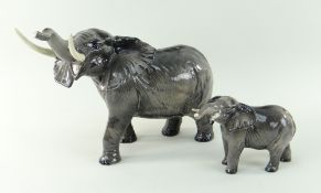 BESWICK GLOSS ELEPHANTS comprising large elephant with outstretched trunk, 24.5cms high, together