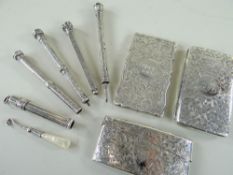 THREE EDWARDIAN SILVER CARD CASES & FIVE PROPELLING PENCILS, the cases engraved all over with