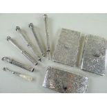 THREE EDWARDIAN SILVER CARD CASES & FIVE PROPELLING PENCILS, the cases engraved all over with