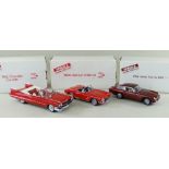 THREE DANBURY MINT 1:24 SCALE DIECAST MODEL CARS, comprising Cadillac Series 62 1959, Chevrolet