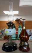 EDWARDIAN BRASS & VASELINE GLASS OIL LAMP and a copper clad brown glass flask (2)