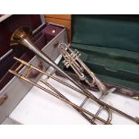 TWO BRASS MUSICAL INSTRUMENTS comprising Boosey & Hawkes Ltd trombone and Higham Magna silvered