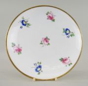 A NANTGARW / SWANSEA STYLE PORCELAIN FRUIT STAND of circular form on raised footring, painted with