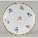 A NANTGARW / SWANSEA STYLE PORCELAIN FRUIT STAND of circular form on raised footring, painted with