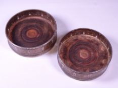 SILVER WITH MAHOGANY BOTTOM WINE BOTTLE COASTERS, A PAIR, London 1978, maker W K B, 12cms diameter