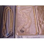 DOUBLE STRAND CULTURED PEARL NECKLACE with part diamond set clasp, Ciro of Bond Street in