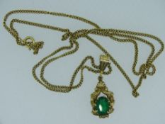 9CT GOLD EMERALD SET PENDANT DROP & NECKLACE, the oval cut stone in a raised setting and ornate