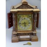 CARVED OAK TWIN FUSEE PRESENTATION MANTEL CLOCK circa 1890, the dial set with Roman numerals,