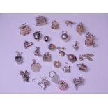 SILVER & WHITE METAL CHARMS approximately 25 in various designs including opening examples, 2.46