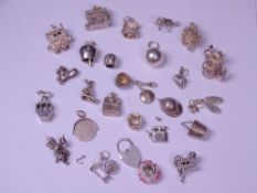 SILVER & WHITE METAL CHARMS approximately 25 in various designs including opening examples, 2.46