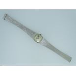 BUECHE-GIROD 9CT WHITE GOLD LADY'S WRISTWATCH, the waisted form integral bracelet strap with bark