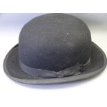 A GENTLEMAN'S BOWLER HAT with supply label W P Lewis, London House, Old Colwyn