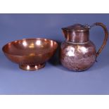 KESWICK SCHOOL INDUSTRIAL ART COPPER LIDDED JUG together with a dish engraved with sea monsters