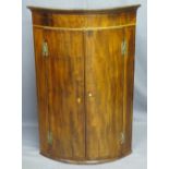 BOW FRONT MAHOGANY WALL HANGING CORNER CUPBOARD, twin door, string inlay 'H' bracket hinges with