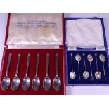 CASED SILVER TEASPOONS, TWO SETS, including six enamel decorated teaspoons, the bowls having various