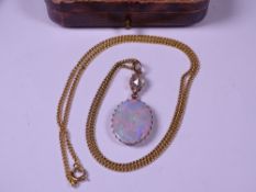 18CT GOLD NECKLACE with pear shape diamond and oval opal pendant drop, 26.5cms overall L, 8mm x