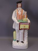 STAFFORDSHIRE PORTRAIT FIGURE OF AN ORGAN GRINDER WITH MONKEY, 38cms H (crazing, slight staining