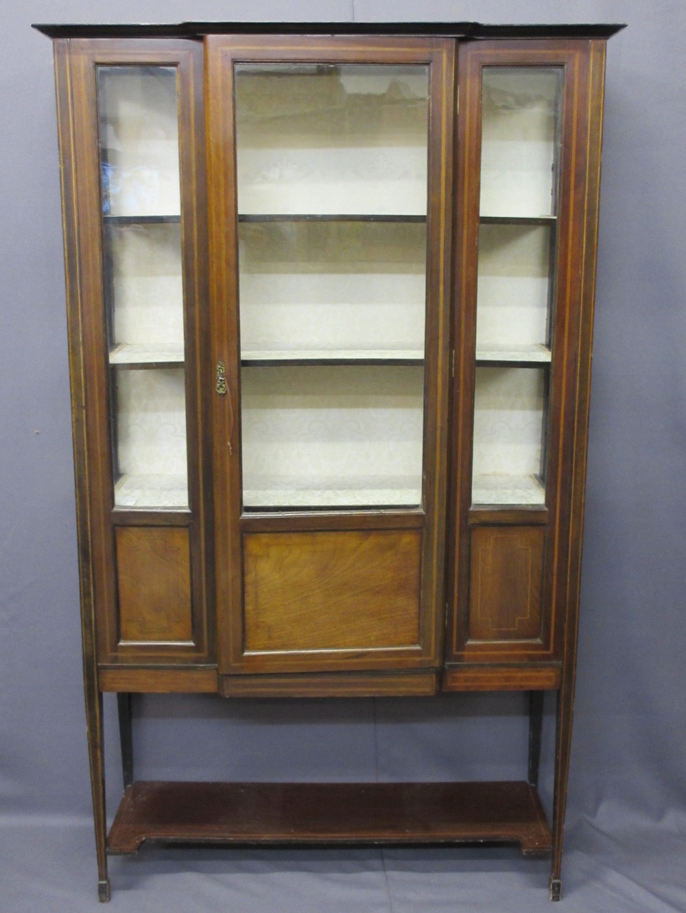 MAHOGANY INLAID BREAKFRONT DISPLAY CABINET, single door, with floral upholstered shelves and back,