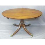 REGENCY MAHOGANY OVAL BREAKFAST TABLE turned column, splayed supports on castors, 70cms H, 123cms W,
