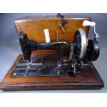 FRISTER & ROSSMAN, GERMANY HAND CRANK SEWING MACHINE in ornate wooden case