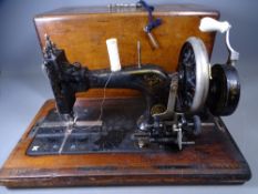 FRISTER & ROSSMAN, GERMANY HAND CRANK SEWING MACHINE in ornate wooden case
